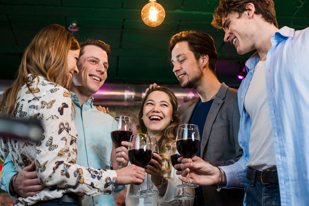 group-happy-friends-enjoying-evening-drinks-bar